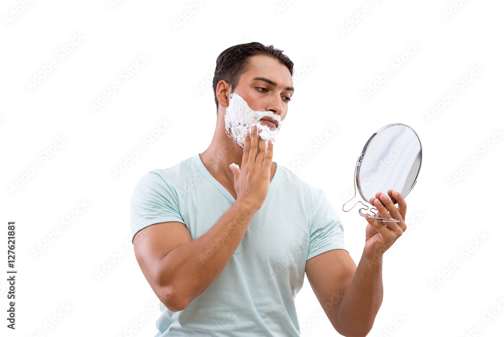 Handsome man shaving isolated on white background Handsome man shaving isolated on white background