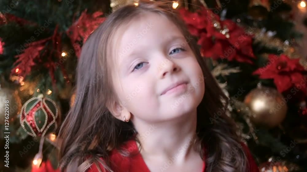 little girl three years in a red dress smiling and having fun little girl three years in a red dress smiling and having fun