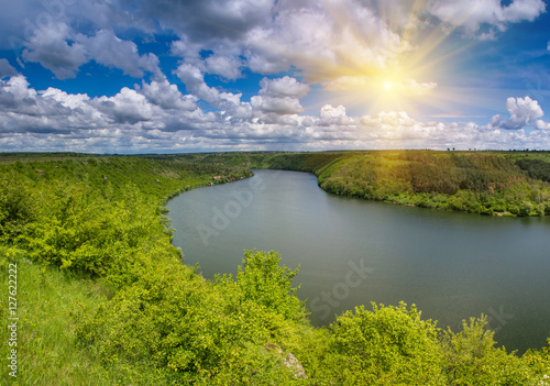 Fototapeta Naklejka Na Ścianę i Meble -  The scenic summer landscape. View of bend of the river. Panoramic view from the hill. 