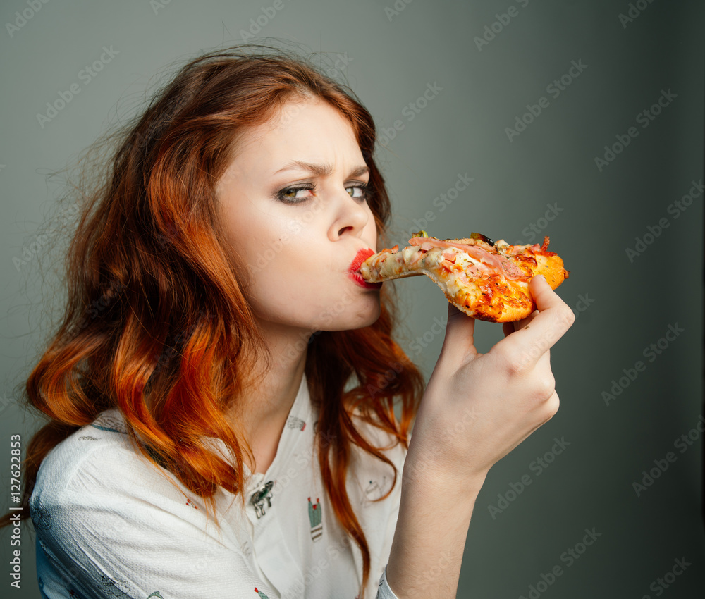 Woman with pizza.  Woman eating pizza
