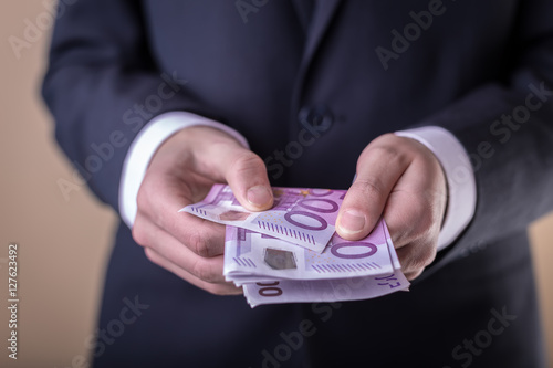 Bribe and corruption with euro banknotes. © am13photo