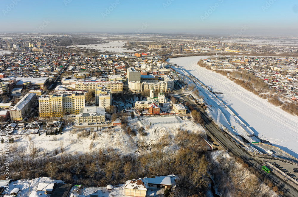 Obraz premium Tyumen, Russia - February 15, 2016: Aerial view onto Nikolsky Vzvoz, Krestovozdvizhensky temple, State architectural and construction university, Holy Trinity Monastery and Tura river quay