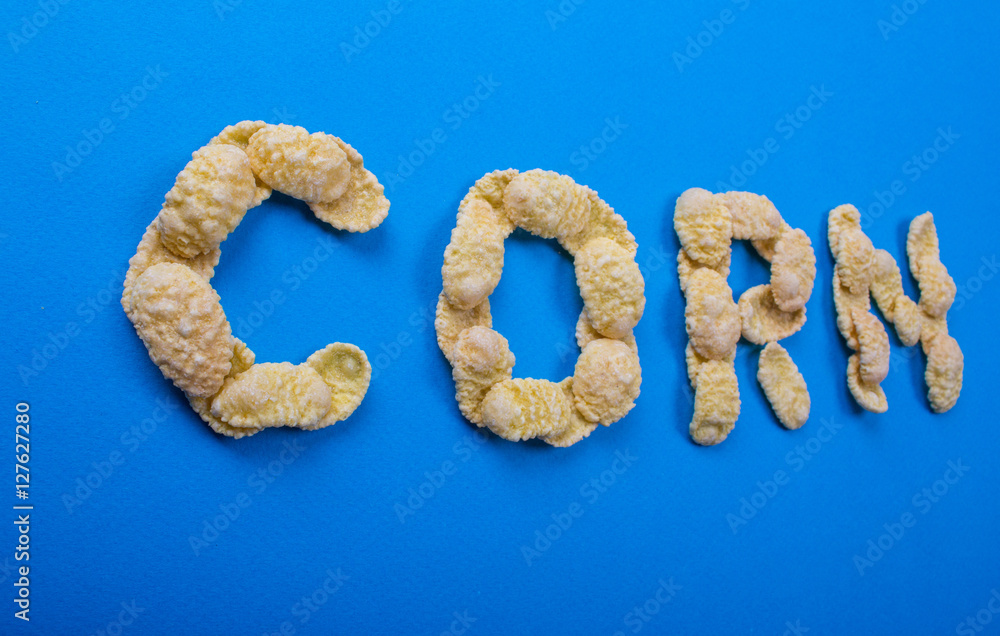 word of corn flakes on a blue background, lettering word of corn flakes on a blue background, lettering