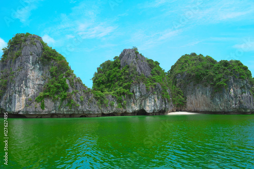 Rock islands in Halong Bay, Vietnam, Southeast Asia. UNESCO World Heritage Site. Scenic landscape with limestone mountains and sea at Ha Long Bay. Most popular landmark, tourist destination of Vietnam