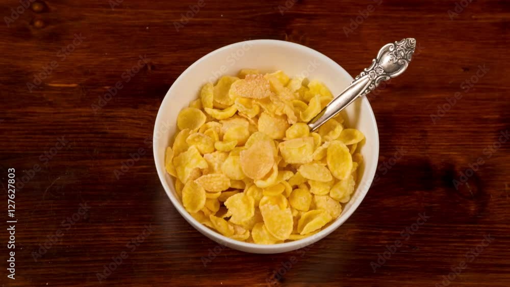 bowl fills cornflakes and milk, stop motion animation