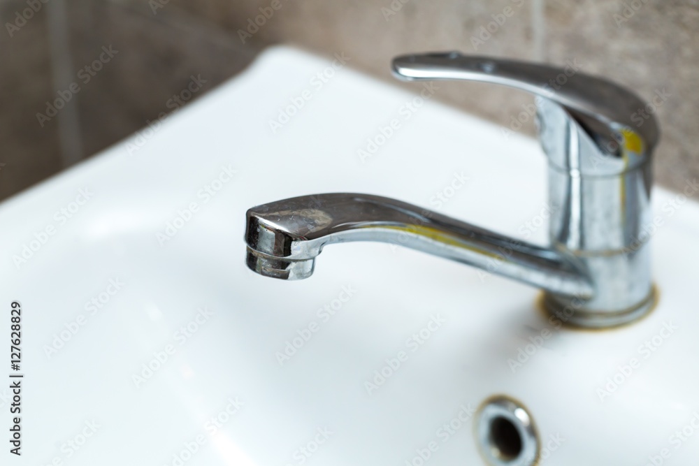 Close up of tap in sink Close up of tap in sink