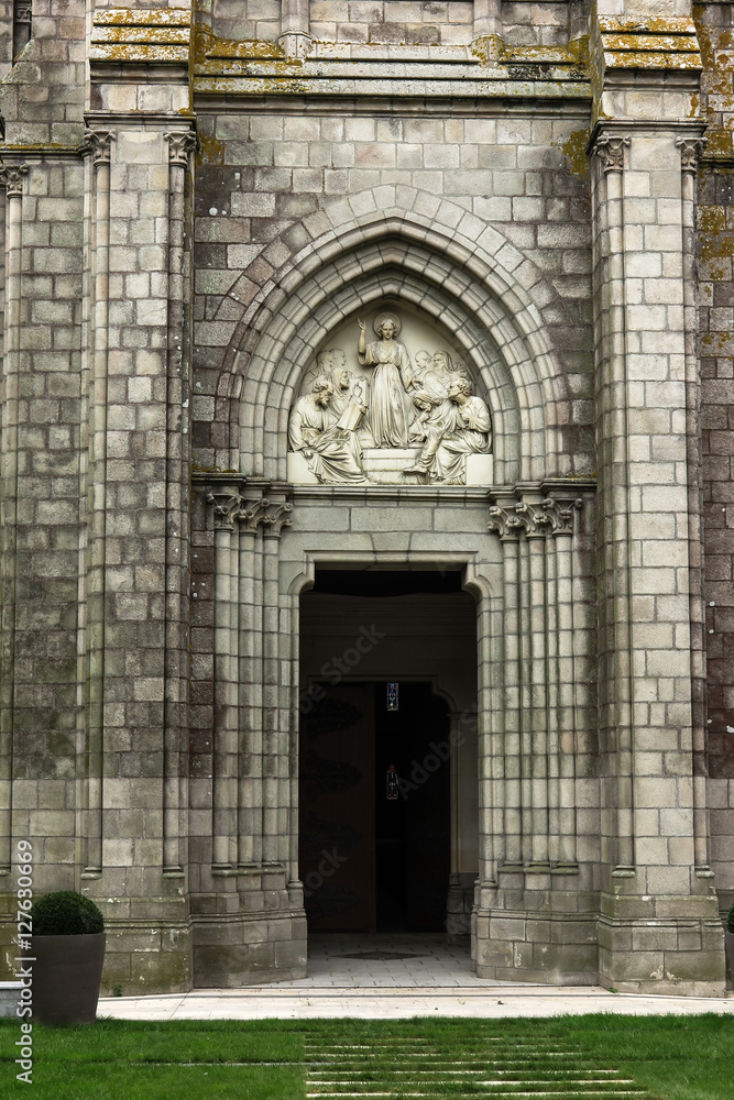 Fototapeta premium Jesus as wisdom among scholars, bas-relief above the door Chapel