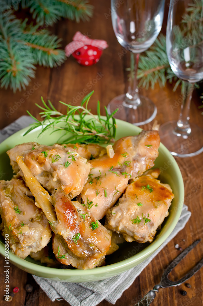 Oven Baked rabbit legs with potatoes and rosemary