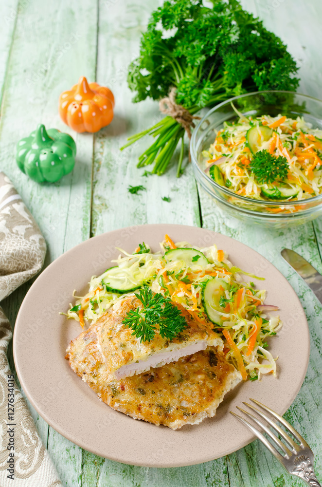 Pork chop in batter with vegetable salad Pork chop in batter with vegetable salad