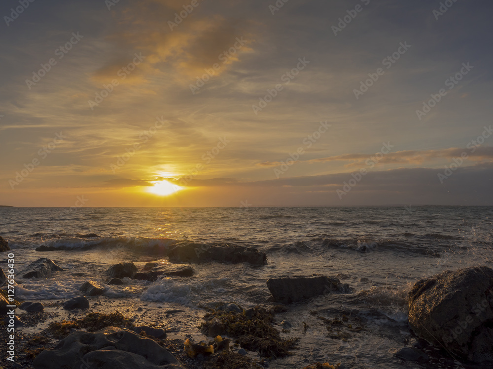 Sun setting down, view from a beach. Sun setting down, view from a beach.