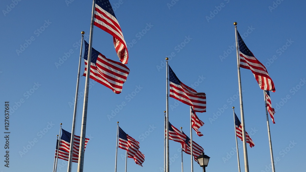 American Flags Waving On Flagpoles American Flags Waving On Flagpoles