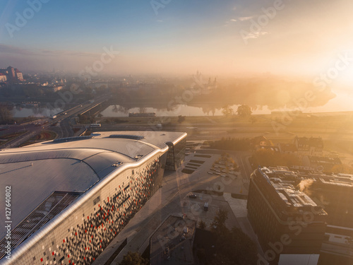 Aerial view of modern city at sunrise on the background - Wawel Castle, Ice Krakow, Poland