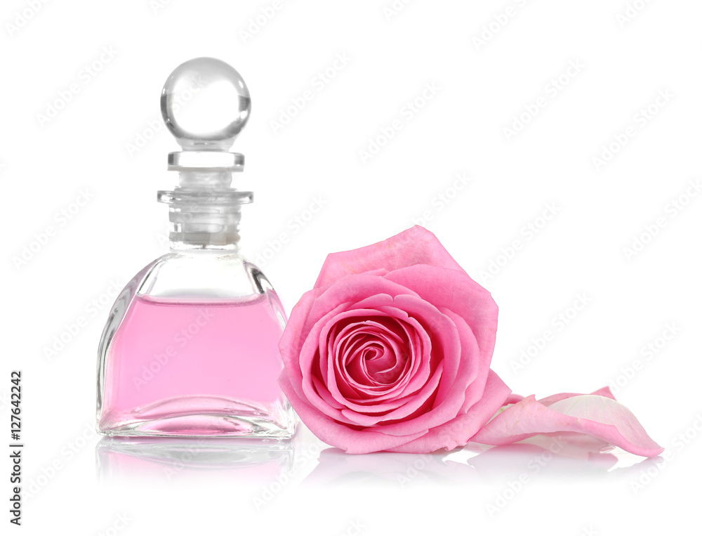 Essential oil with rose on white background Essential oil with rose on white background