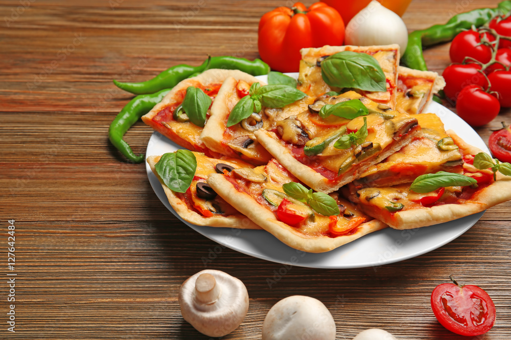 Delicious pizza slices on plate Delicious pizza slices on plate