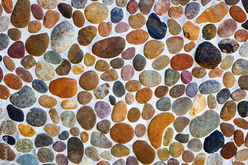 Pebble stone floor tile texture background.