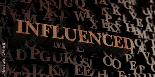 Influenced - Wooden 3D rendered letters/message. Can be used for an online banner ad or a print postcard.