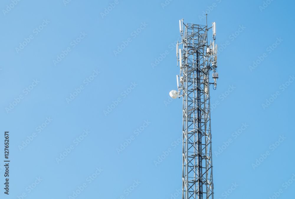 communication antenna tower, radio, television, telephone with a bright blue sky. background