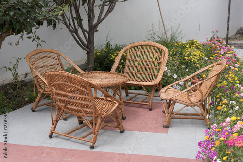 Wicker or Cane chairs. Rattan chair set in the garden. image in natural light.