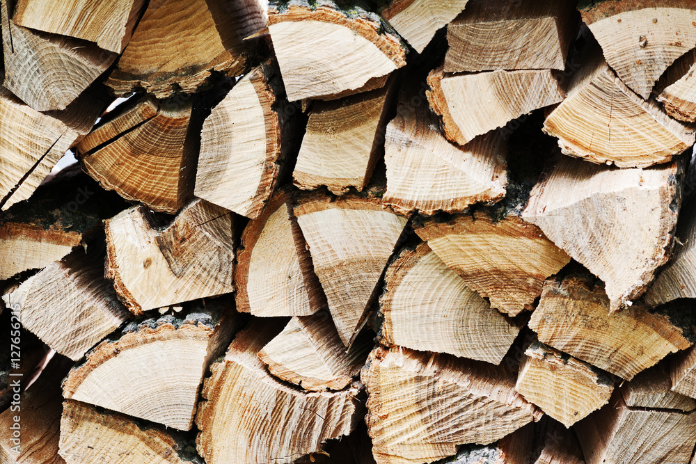 Dry chopped firewood logs in pile. Nature background. Dry chopped firewood logs in pile. Nature background.