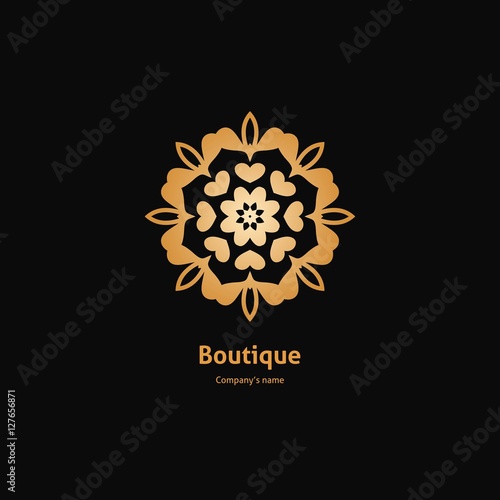 Luxury logotype in the shape of a flower for antique boutique. Gold logo, flower