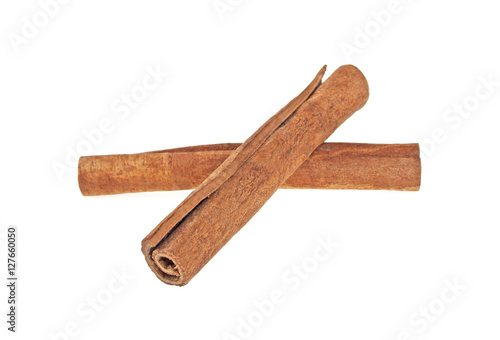 Two cinnamon sticks isolated on white background