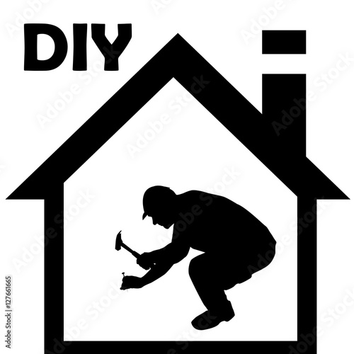 Male manual worker working with hammer