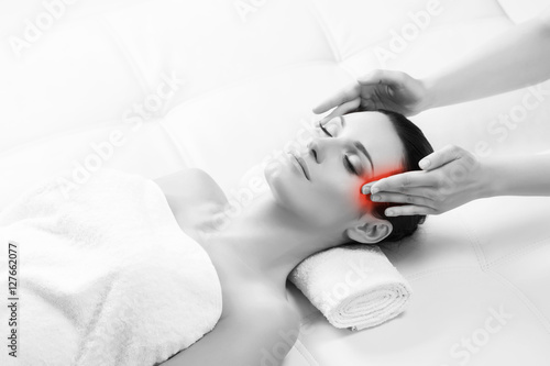 Young woman on a head massage therapy