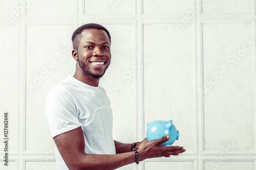 businness black man with piggy bank photo