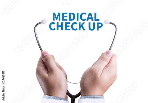 MEDICAL CHECK UP  Doctor checking patient arterial blood pressur photo