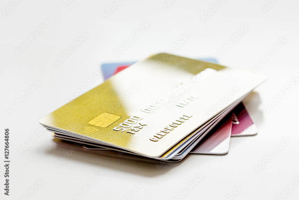 pile of credit cards on white background pile of credit cards on white background