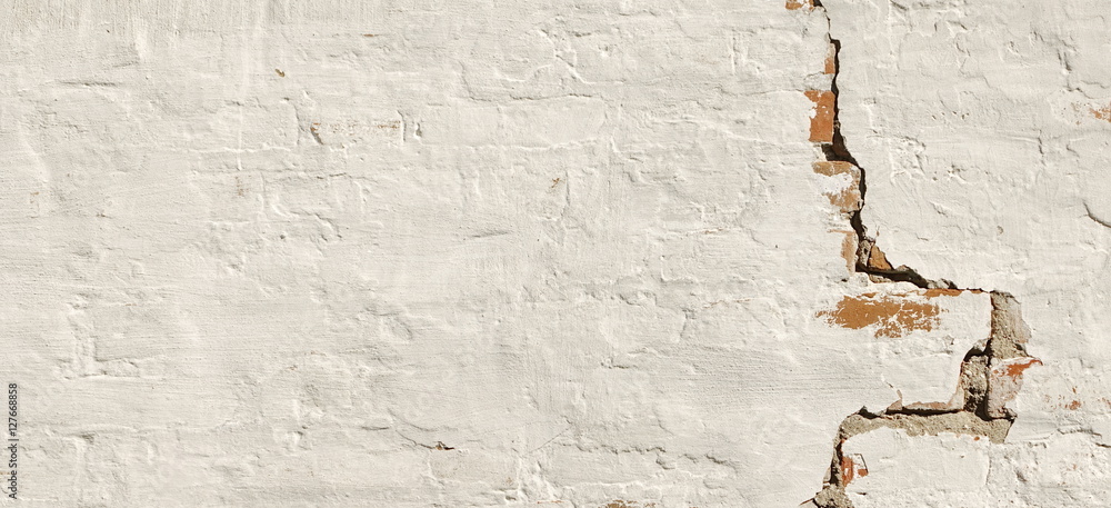 Fototapeta premium Cracked Red Brick Wall With Shabby White Plaster Background Tex