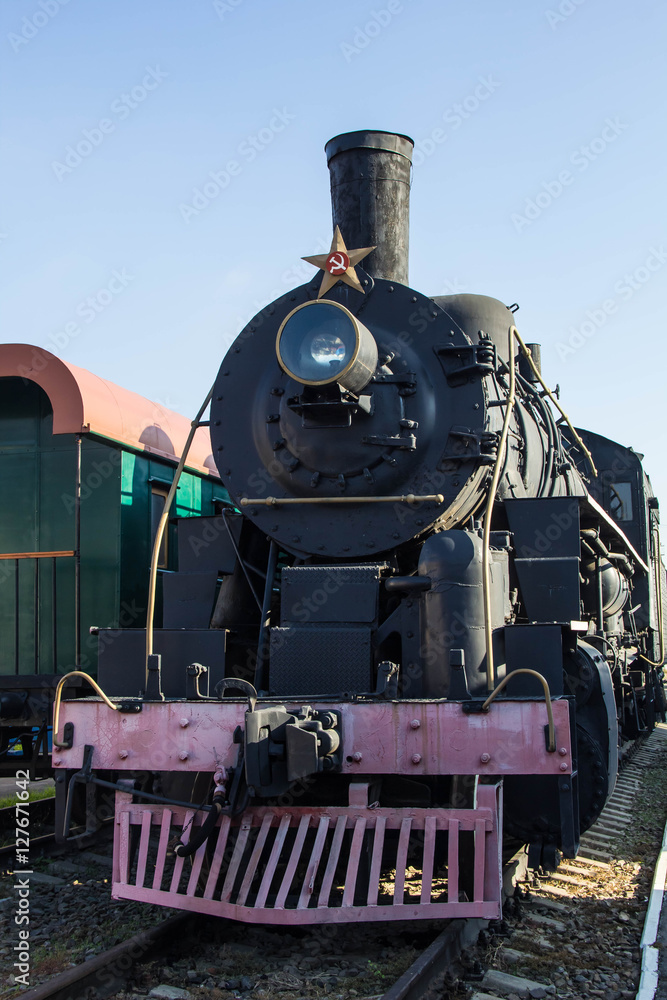 Fototapeta premium Old restored steam train with wagons