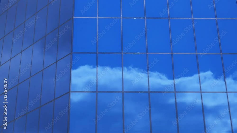 clouds reflection on a glass facade - modern office Building - time lapse clouds reflection on a glass facade - modern office Building - time lapse