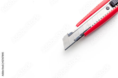 Red paper knife isolated on white background