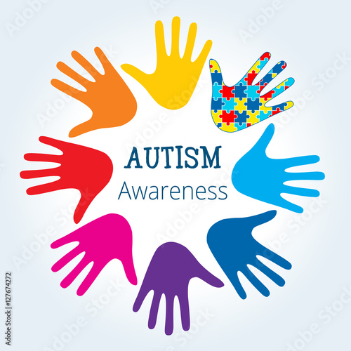 Autism awareness concept with hand of puzzle pieces as symbol of autism.