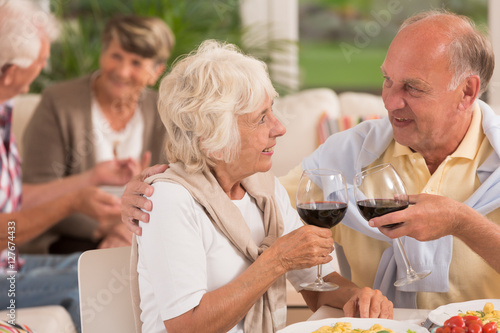 Senior marriage drinking with their friends