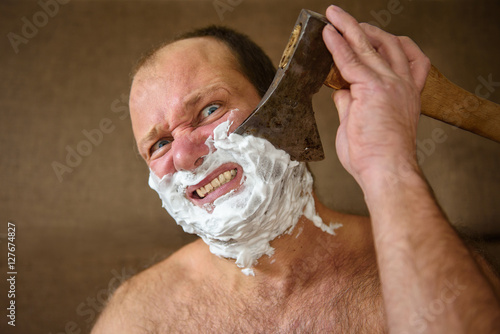 Man shaves with an ax 