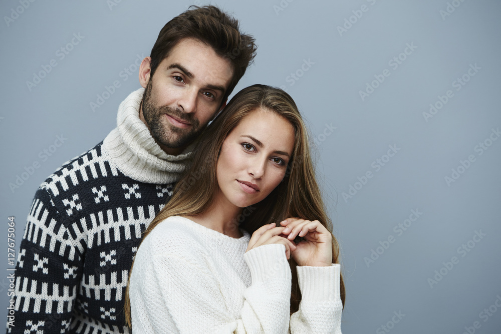 Knitwear couple in studio, portrait Knitwear couple in studio, portrait