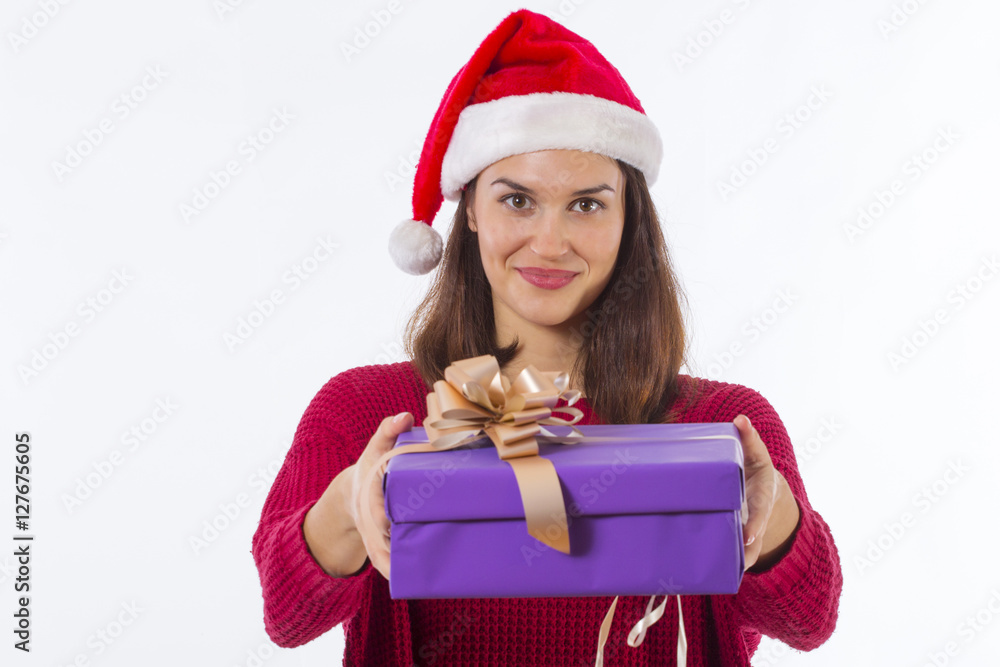 Girl with santa hat and present on her hands Girl with santa hat and present on her hands