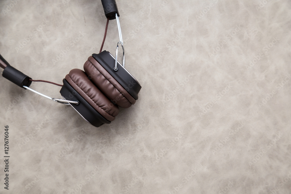 brown vintage style headphone on floor with free copy space for