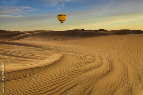 Hot Air Balloon in the desert at sunset background