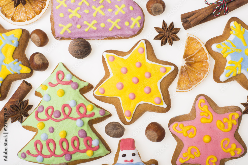 Gingerbread cookies and spices over white background close up. Christmas ginger and honey cookies on isolated white background. Prepare for xmas eve or other winter holidays Gingerbread cookies and spices over white background close up. Christmas ginger and honey cookies on isolated white background. Prepare for xmas eve or other winter holidays