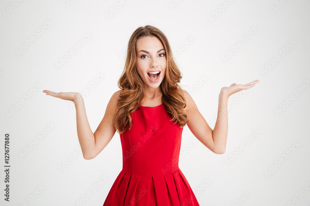 Woman in santa claus dress holding copyspace on two palms Woman in santa claus dress holding copyspace on two palms