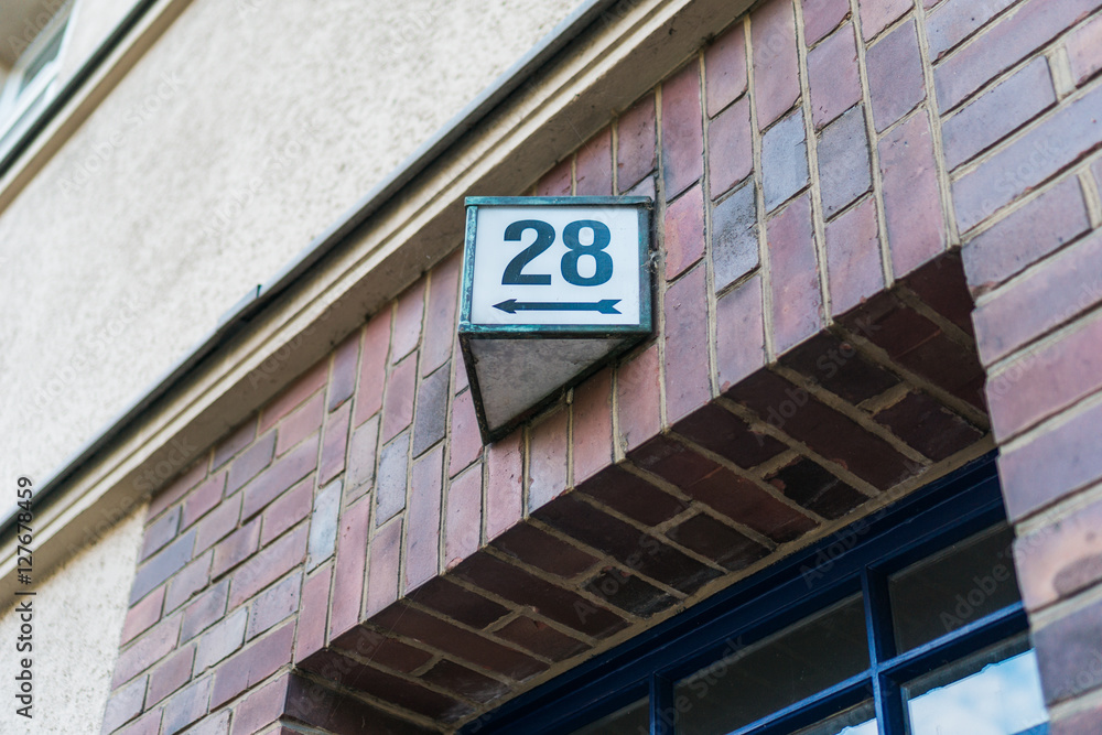 Obraz premium weathered house number twenty eight (28)