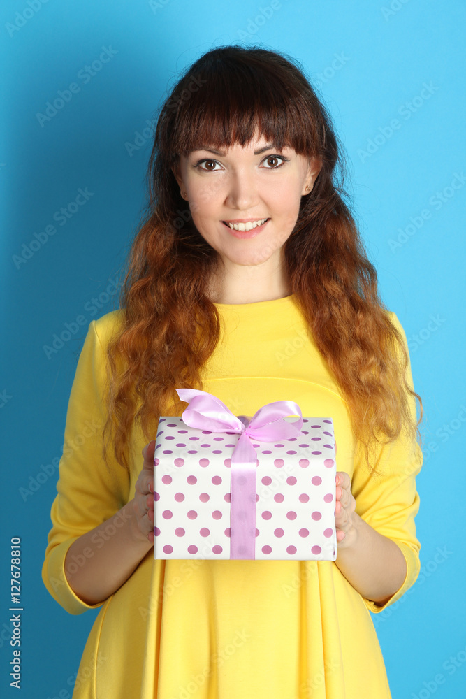 Portrait of a happy girl with a gift in their hands. Portrait of a happy girl with a gift in their hands.