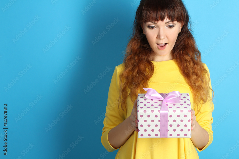 Portrait of a happy girl with a gift in their hands. Portrait of a happy girl with a gift in their hands.