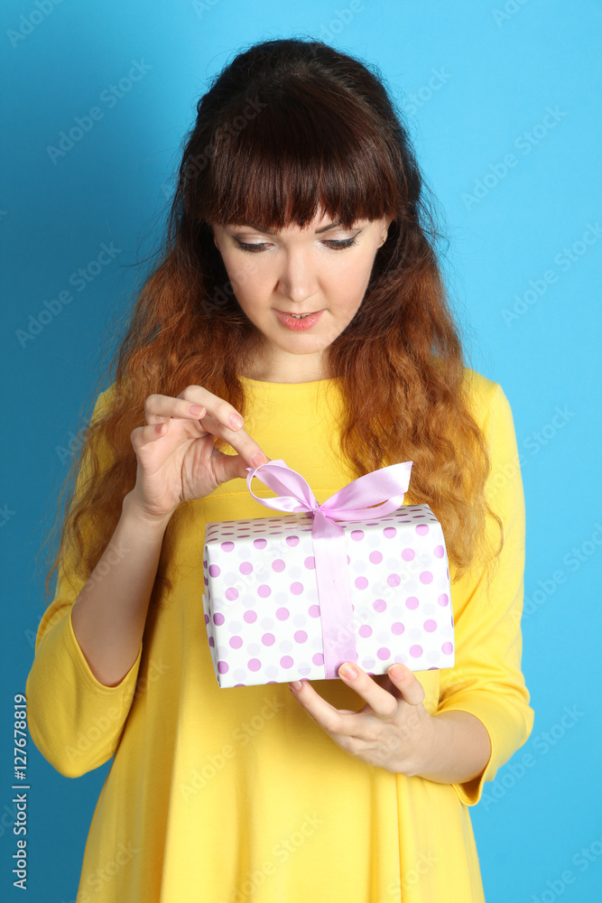 Happy girl with a gift in their hands. Happy girl with a gift in their hands.