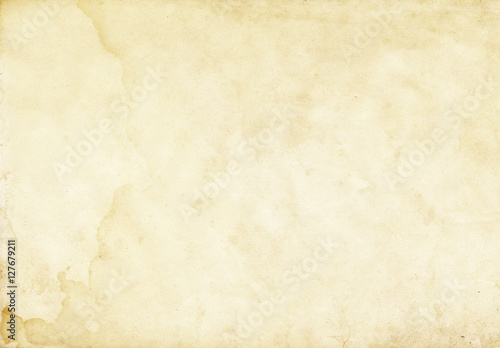 Old yellowed and stained paper texture. photo