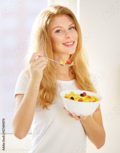 Girl eating corn flakes