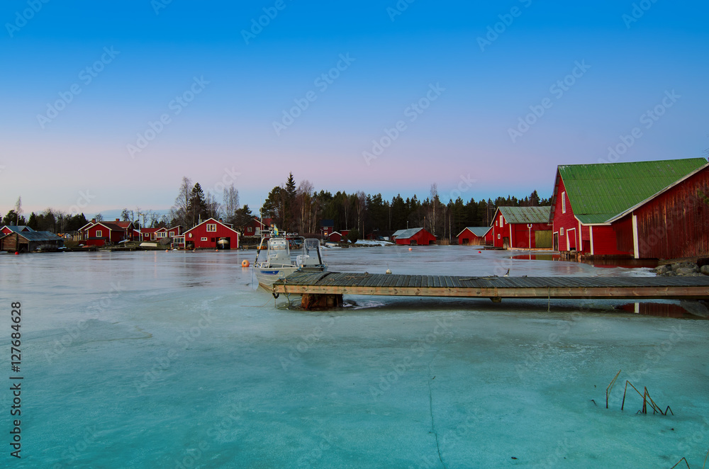 Fisherman village in Sweden at winter after sunset - winter seasonal scandinavian background